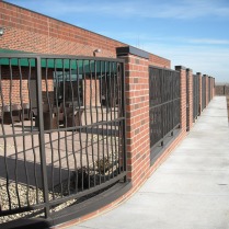 Commercial fencing with solid bar bent pickets, Thornton, CO.