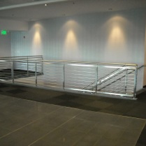 Commercial interior Stainless Steel guard/hand rails with horizontal solid bar infill.