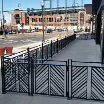 Downtown Denver railings at Kachina Restaurant, Coors Field in the backdrop.